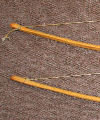 Pair of early medieval ash self knocked longbows with hand braided bow strings. Size: approx. 1800mm long